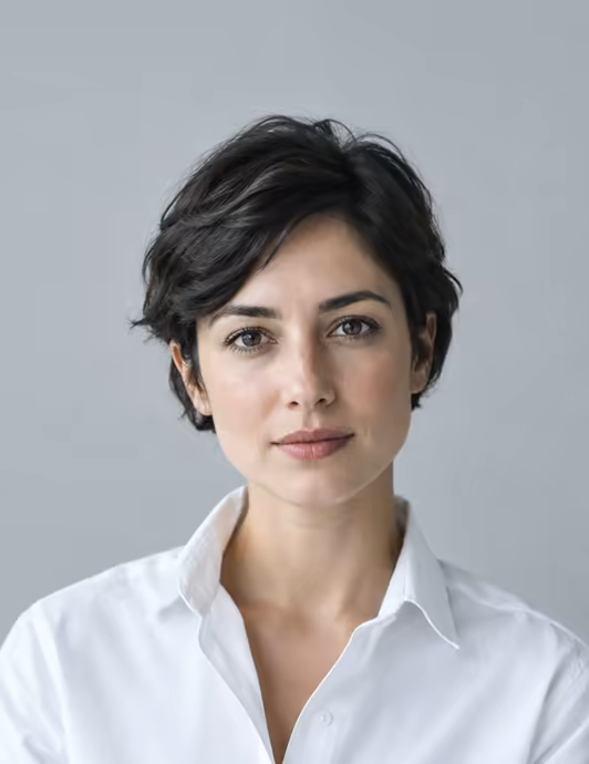 A candidate in a white shirt with a calm, direct expression.