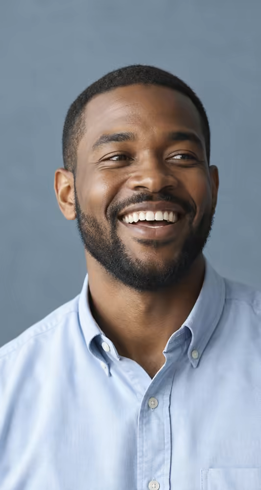 A candidate in a light blue shirt laughing.